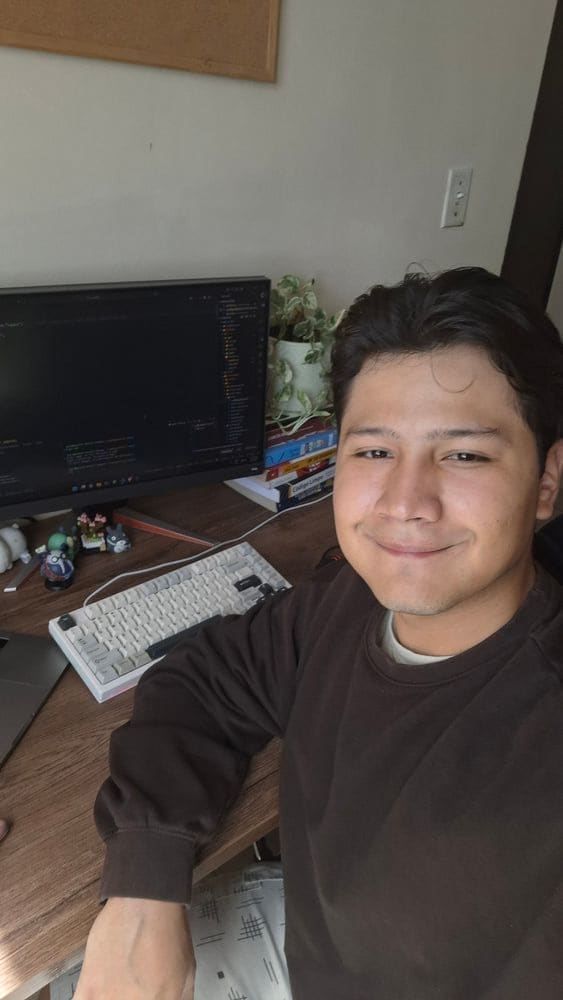 Esteban Lozada on his homeofice workspace, showing his work as a software developer